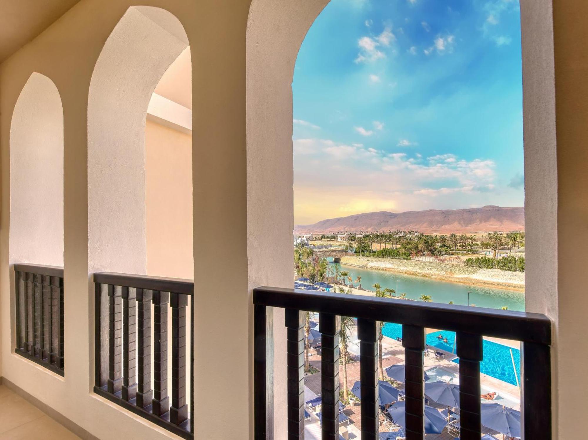 Fanar Hotel & Residences Salalah Exterior photo View from the balcony of a suite at the Hilton Palm Springs